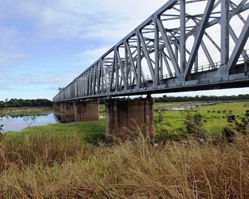 Diver from Gilbert Diving inspects Railway Bridge over a river in Queensland, Australia